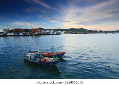 Fishing boats floating in the Sattahip Sea with the background of the market and Wat Sattahip.
Chonburi ,Thailand  - Shutterstock ID 2224516535