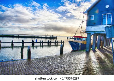 Fishing boats moored in the marina and waterfront of Volendam, Netherlands
