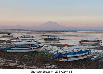 Fishing boats on the coral beach with mountain on the background. - Shutterstock ID 2367219461