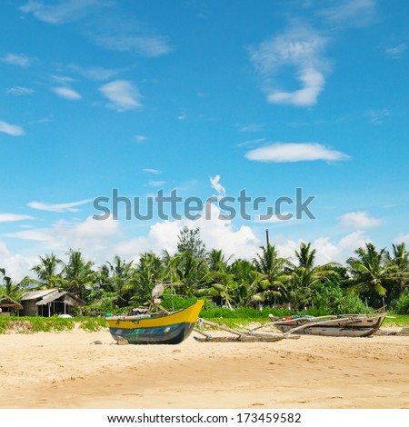 Fishing boats on a tropical beach