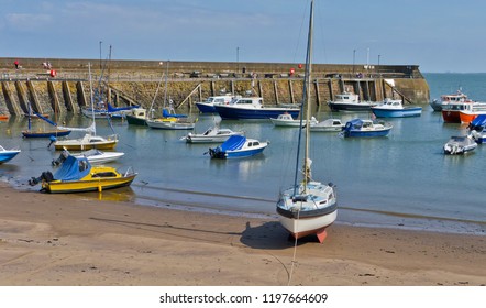 fishing boats, sail boat and low tide in England