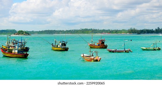 Fishing boats in  sea lagoon. Sri Lanka. Wide photo.