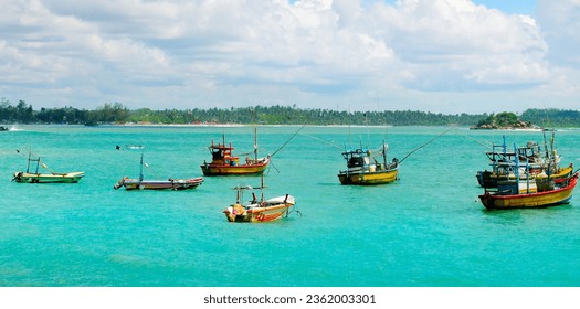 Fishing boats in the sea . Sri Lanka. Wide photo.