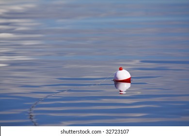 Fishing Bobber Floating In Lake