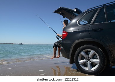 Fishing From A Car By The Beach