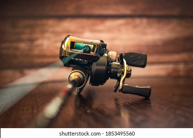 fishing casting reel on a rod with a cord