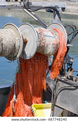 Fishing colored net on boat industrial fish
