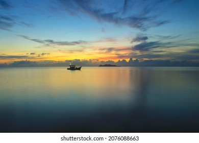 Fishing Dinghy In The Middle Of The Sea In The Afternoon