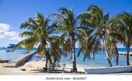 Fishing Dock In Grand Cayman With Blue Ocean And Ships In The Horizon