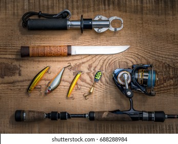 Fishing equipment still life on wooden background - Shutterstock ID 688288984