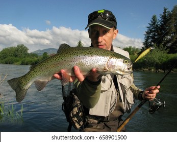 Fishing - Fisherman Catch Rainbow Trout On River