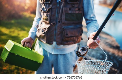 Fishing. Fisherman with fishing equipment. Sport, recreation concept - Powered by Shutterstock