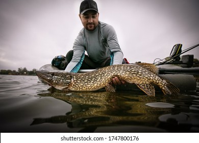  Fishing. Fisherman And Trophy Pike.