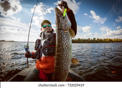 Fishing. Fisherman And Trophy Pike.