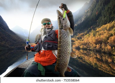 Fishing. Fisherman And Trophy Pike.