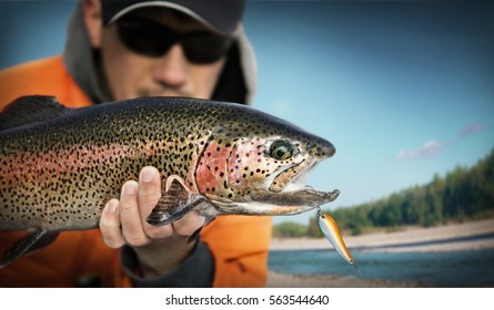 Fishing. Fisherman And Trout.