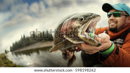 Fishing. Fisherman and trout. Dramatic.
