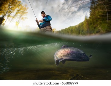 Fishing. Fisherman and trout, underwater view.