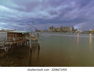 A Fishing Hut In Front Of A Factory