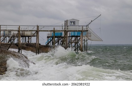 Fishing Huts With Nets On The Atlantic Ocean Coast Near Le Pont Du Diable In France, Rough Sea