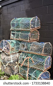 Fishing industry icon, colorful lobster pots stacked up
