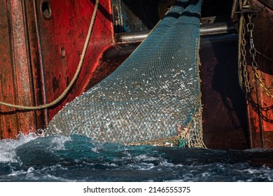 Fishing Net Of A Trawler Is Hauled On Deck