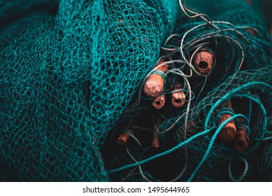 A fishing net is a net used for fishing. Nets are devices made from fibers woven in a grid-like structure. Some fishing nets are also called fish traps, for example fyke nets.