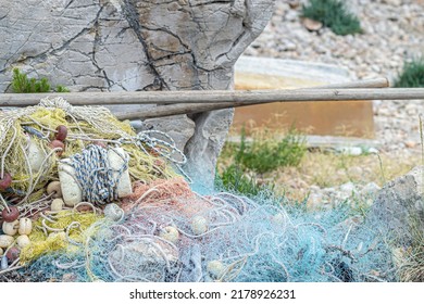 Fishing nets, corks and ropes stacked, fisherman equipment