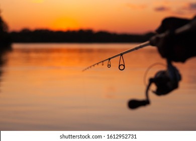 Fishing On The River At Sunset