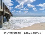 Fishing Pier in Lake Worth Florida, USA on the Atlantic Ocean. It is a late winter day