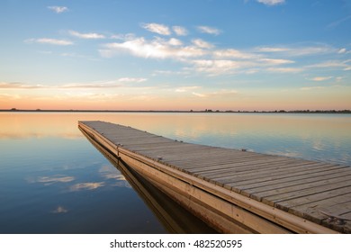 A Fishing Pier On A Colorado Lake In Larimer County At Sunrise