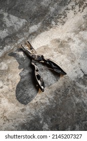 Fishing Pliers On Cement Floor