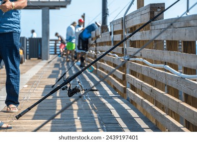 Fishing poles on the dock of Atlantic Ocean - Powered by Shutterstock