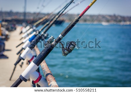 Fishing Polls in a Row on Pier in San Diego Bay, California.