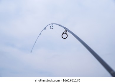 Fishing Rod Is Bent And Fully Tensed. Rod Rings.