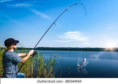 fishing rod lake fisherman men sport summer lure sunset water outdoor sunrise fish - Powered by Shutterstock