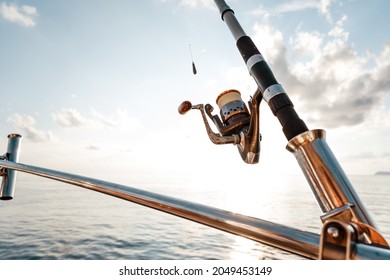 Fishing rod on a sailboat on the background of the sea