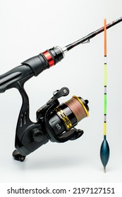 Fishing Rod With A Reel And Float On A White Background.