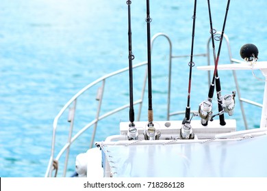 Fishing Rods On A Yacht Board. Sea Fishing In Clear Sunny Weather.