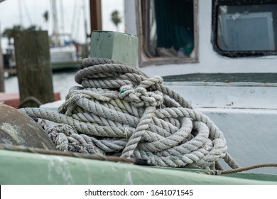 Fishing Rope Piled Up On Deck Of Boat Close Up.