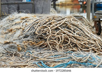 Fishing ropes and nets, no longer used on Poole quay, signs of a declining fishing industry 