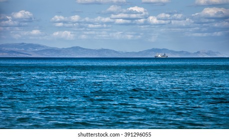 Fishing ship on the horizon