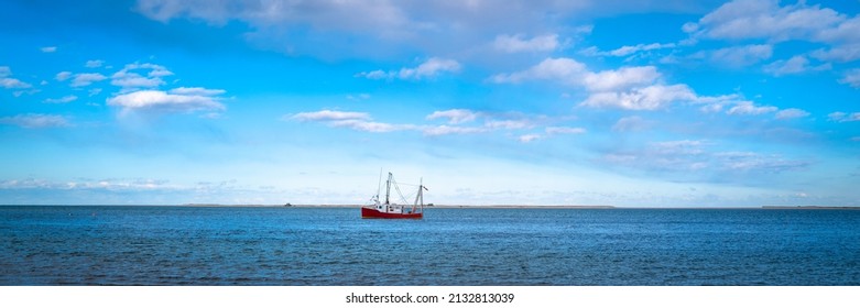 A Fishing Ship At The Sea On The Horizon