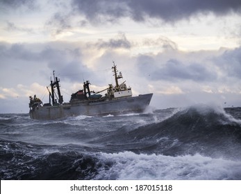 Fishing Ship In Strong Storm. Sunrise.