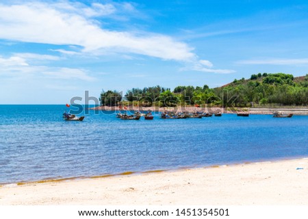Fishing ships at a seaport in Cua Lo beach, Nghe An, Vietnam. Beautiful landscape is composed by small fishing ships in blue sky and sea background. Imagine de stoc © 