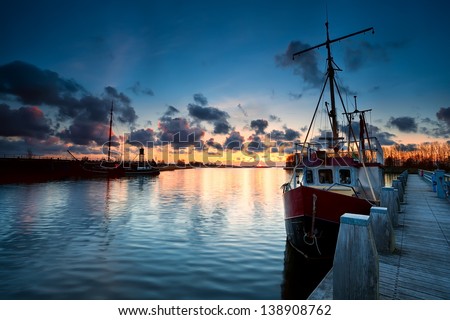 fishing ships at sunset in Zoutkamp, Netherlands