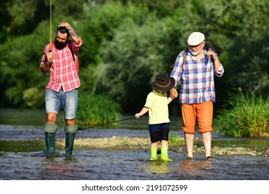 Fishing With Son And Grandson. Grandfather And Father With Cute Child Boy Are Fishing.