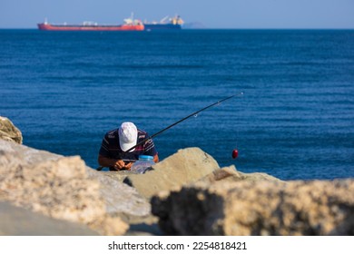 Fishing tackle, fishermen and fishing rods in the sea. - Shutterstock ID 2254818421