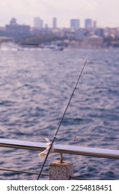 Fishing tackle, fishermen and fishing rods in the sea. - Shutterstock ID 2254818451