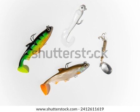 Fishing tackle on awhite background. Top view. colorful silicone fish lures with hooks fishing equipment